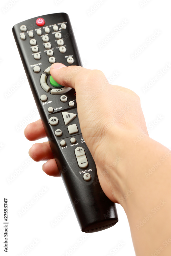 A hand holding a remote control a white background. A hand holding a remote control a white background.