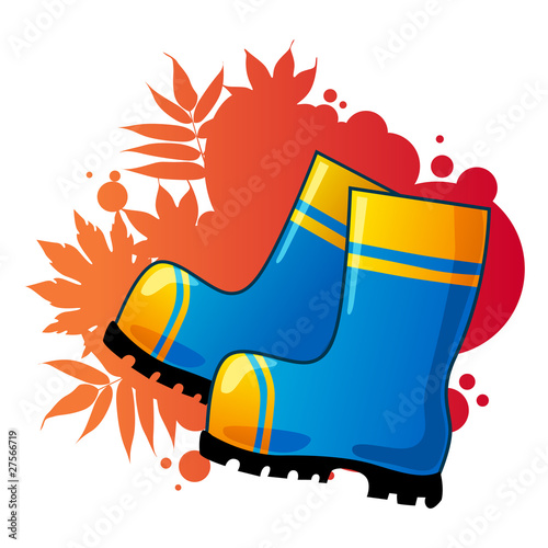 Blue rubber boots on autumnal background.