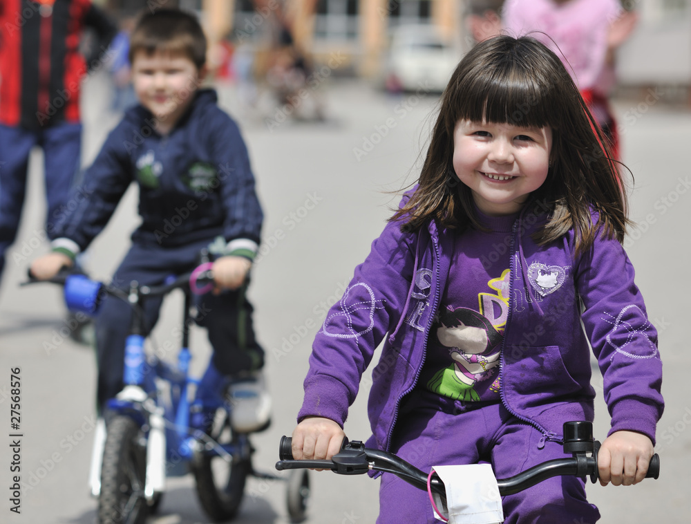 happy childrens group learning to drive bicycle happy childrens group learning to drive bicycle