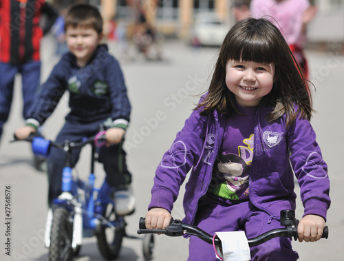 happy childrens group learning to drive bicycle © .shock