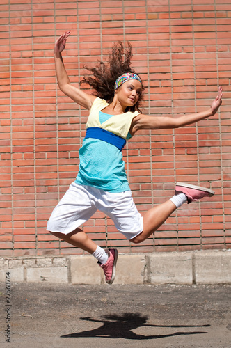 Beautiful teenage girl dancing hip-hop © mr.markin