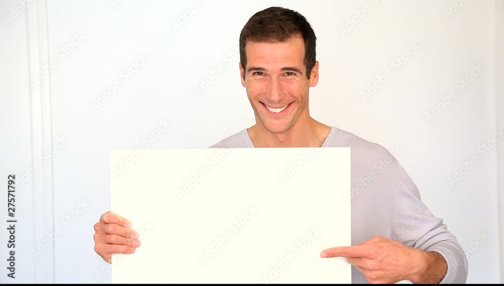 Man showing white message board Man showing white message board