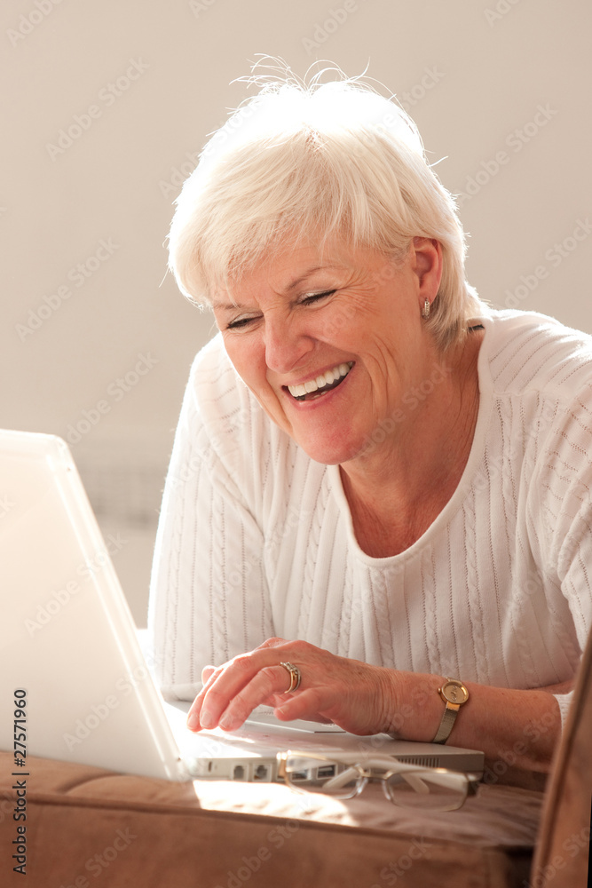 Attractive woman baby-boomer with laptop Attractive woman baby-boomer with laptop