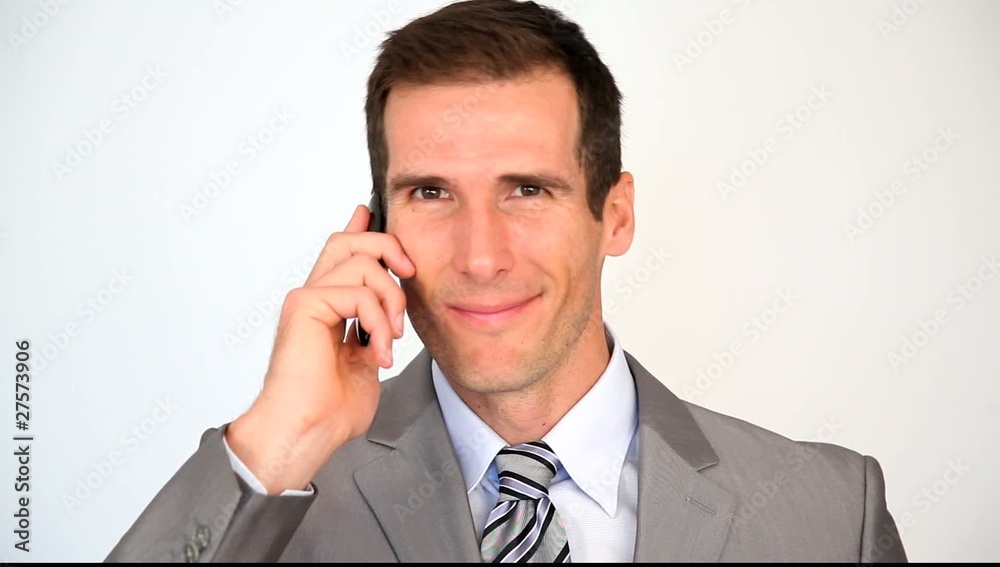 Smiling businessman on the phone Smiling businessman on the phone