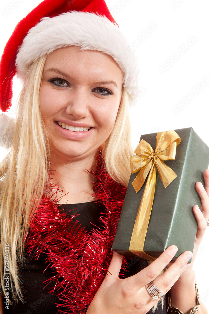 portrait of woman with christmas hat and present portrait of woman with christmas hat and present