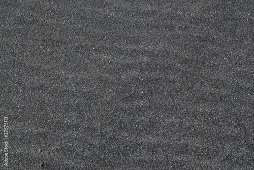 Lavasand grau Lava Hintergrund Wellen Sand Fuerteventura