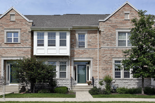 Brick townhouse with cedar roof