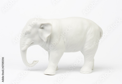 White elephant figure over white background.