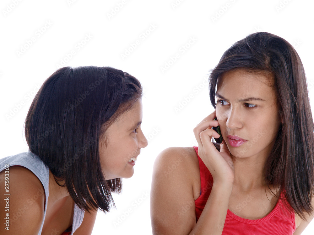 girl on the phone annoyed at eavesdropping sister girl on the phone annoyed at eavesdropping sister