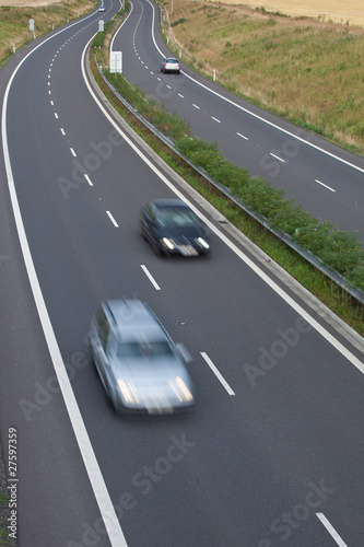 highway traffic  motion blurred image  color toned image 
