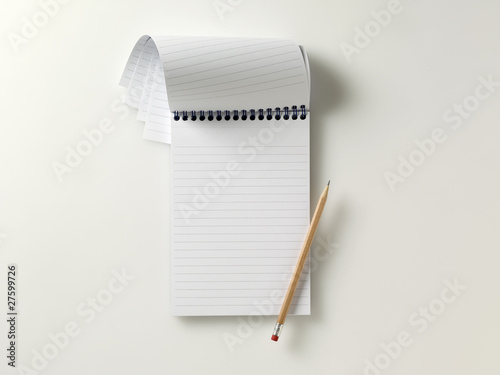 blank reporters notebook with pencil photo