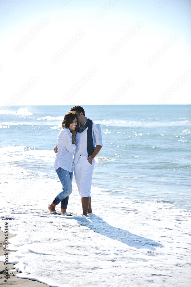 happy young couple have fun at beautiful beach happy young couple have fun at beautiful beach
