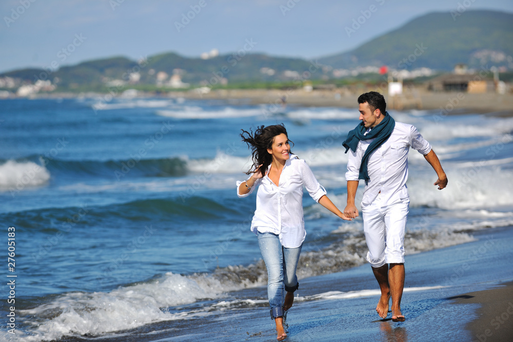 happy young couple have fun at beautiful beach happy young couple have fun at beautiful beach