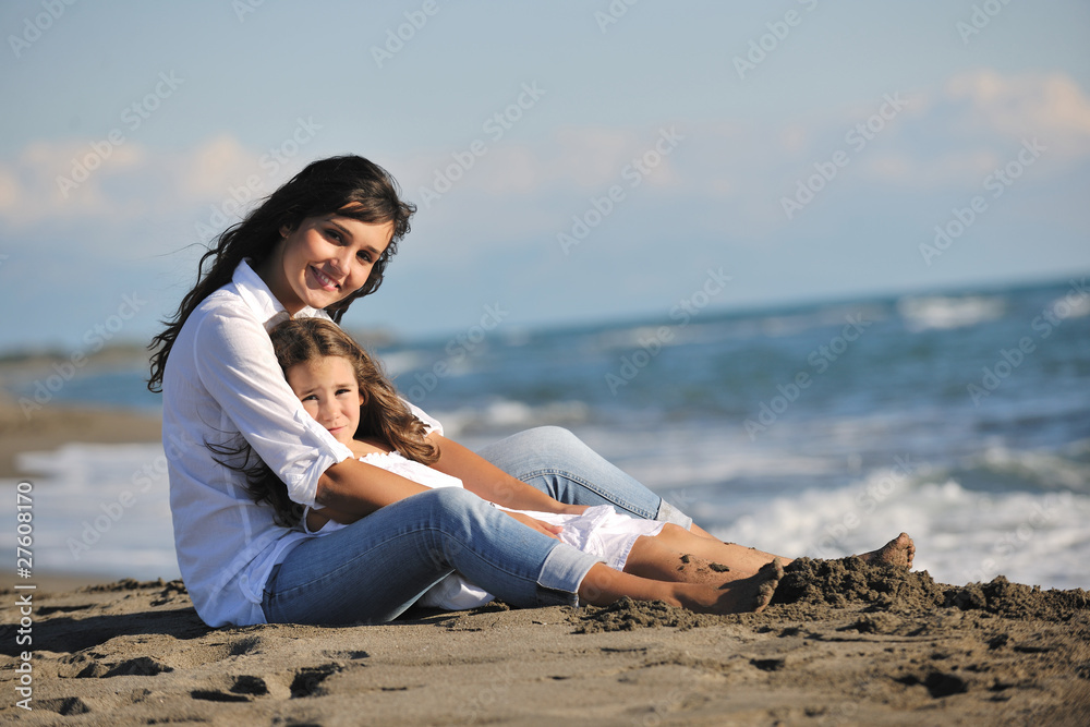 mom and daughter portrait on beach