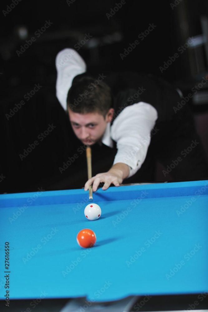 Fototapeta premium young man play pro billiard game