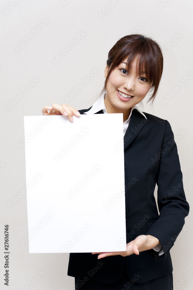 a portrait of young business woman taking a blank white board a portrait of young business woman taking a blank white board