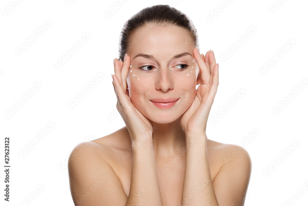 Beautiful sexy woman applying cosmetic cream on skin near eyes Beautiful sexy woman applying cosmetic cream on skin near eyes