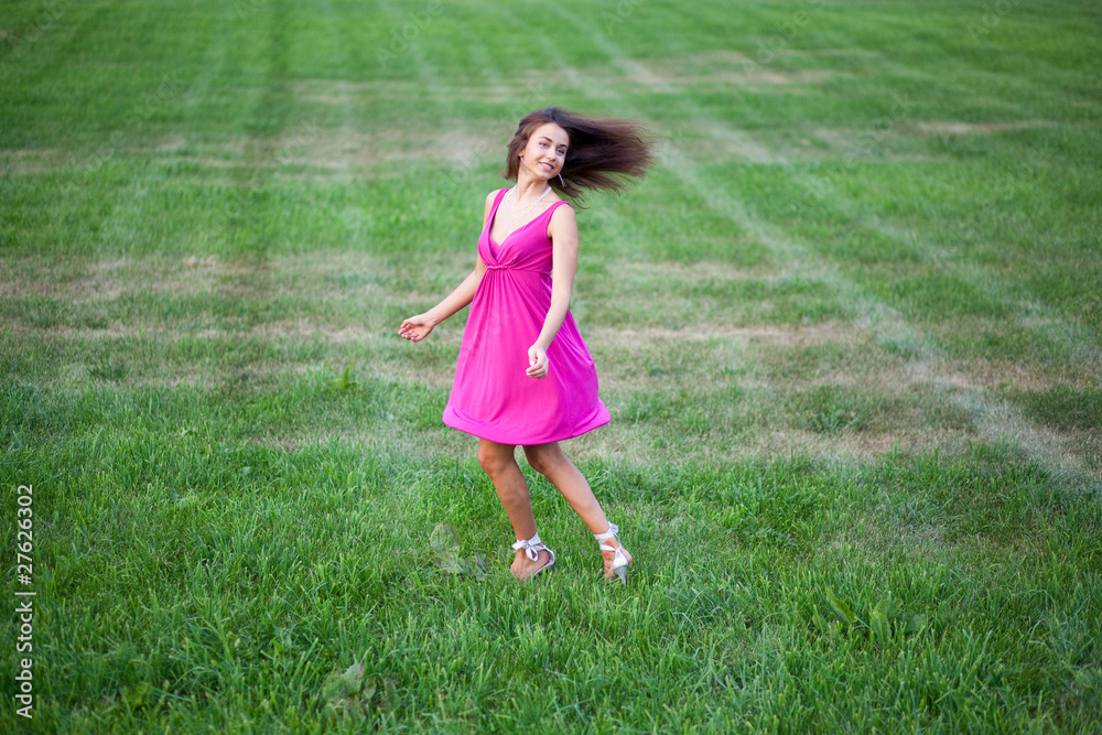 Beautiful young woman running on the field Beautiful young woman running on the field