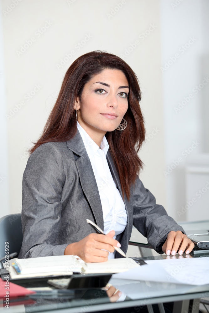 Closeup of smiling real estate agent in office Closeup of smiling real estate agent in office