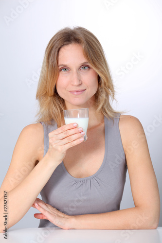 Closeup of beautiful woman drinking milk