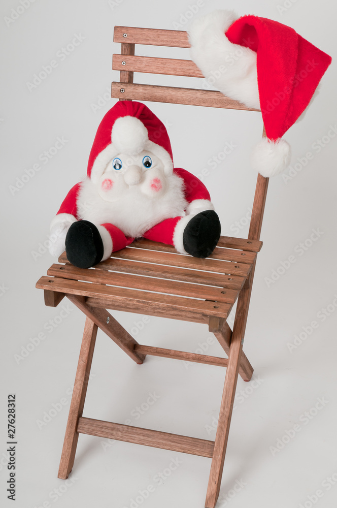 Weihnachtsmann auf Stuhl Stock Photo | Adobe Stock