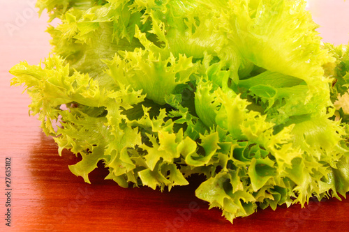 Green salad on wooden background