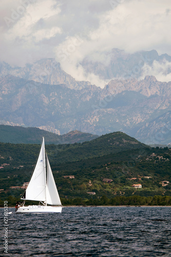 small yacht sailing on sea near Corsica island