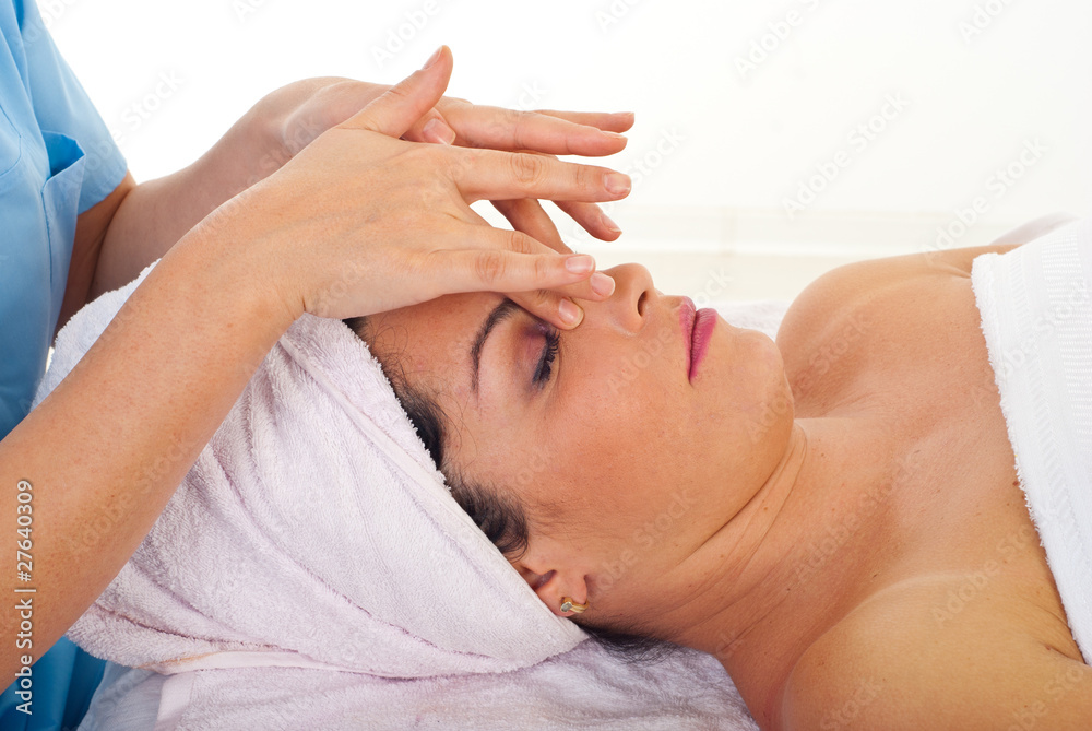 Woman relaxing with facial massage