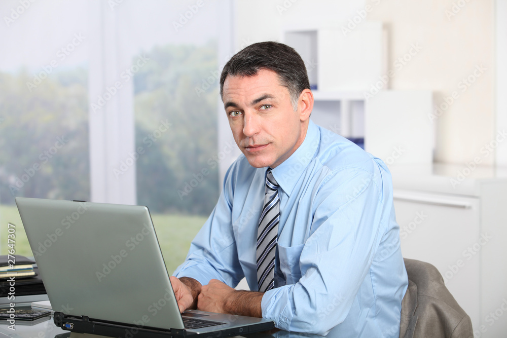 Businessman working on laptop computer