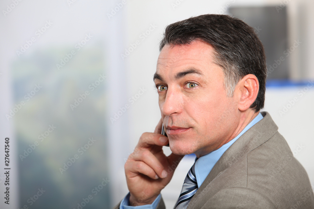 Closeup of businessman talking on the phone