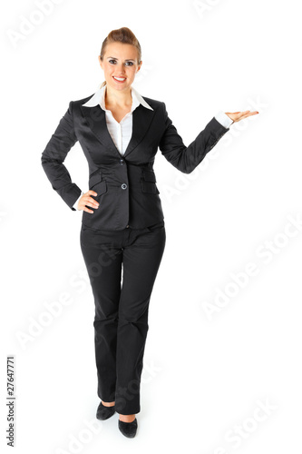 Smiling business female presenting something on empty hand
