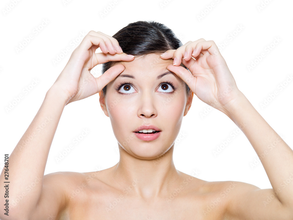 Female face with the wrinkles on her forehead Female face with the wrinkles on her forehead