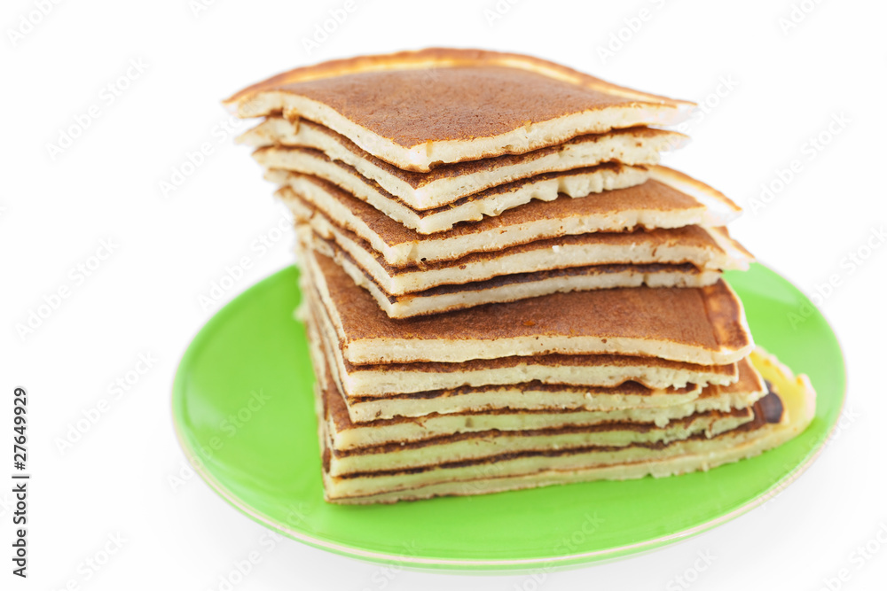 Pancakes on a plate isolated on white