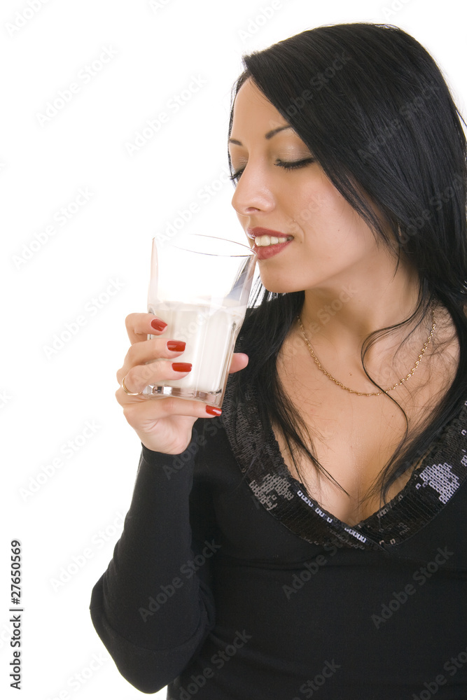Beautiful brunette woman holding glass of milk Beautiful brunette woman holding glass of milk