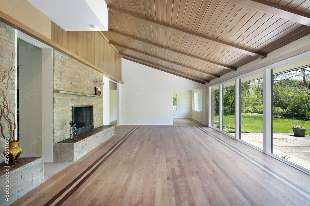 Naklejka premium Family room with stone fireplace