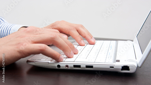 Businessman typing on the laptop
