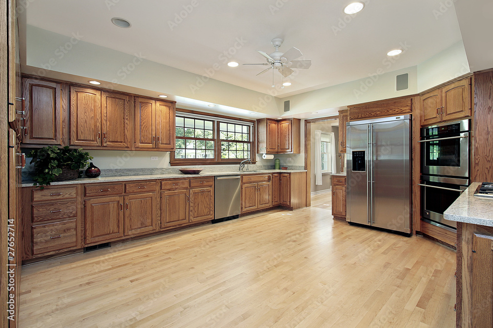 Fototapeta premium Kitchen with oak wood cabinetry