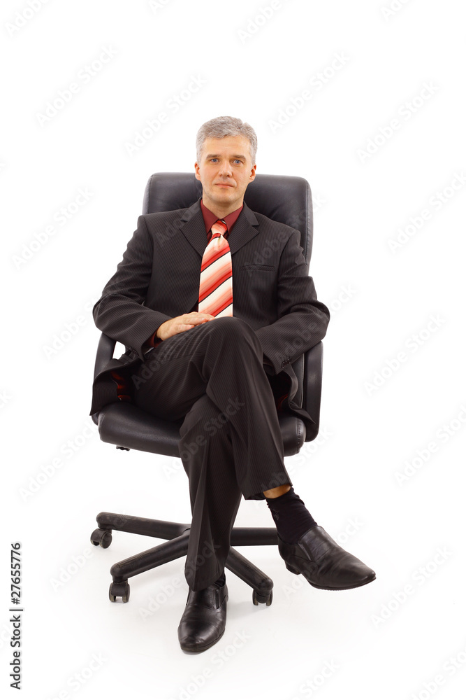 Isolated portrait of a senior businessman sitting on a chair Isolated portrait of a senior businessman sitting on a chair