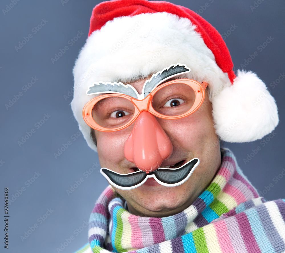 man in a ridiculous Santa Claus mask in the warm scarf man in a ridiculous Santa Claus mask in the warm scarf