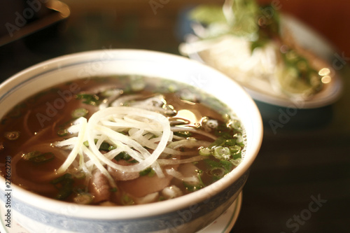 Vietnamese pho noodles with beef at a restaurant.