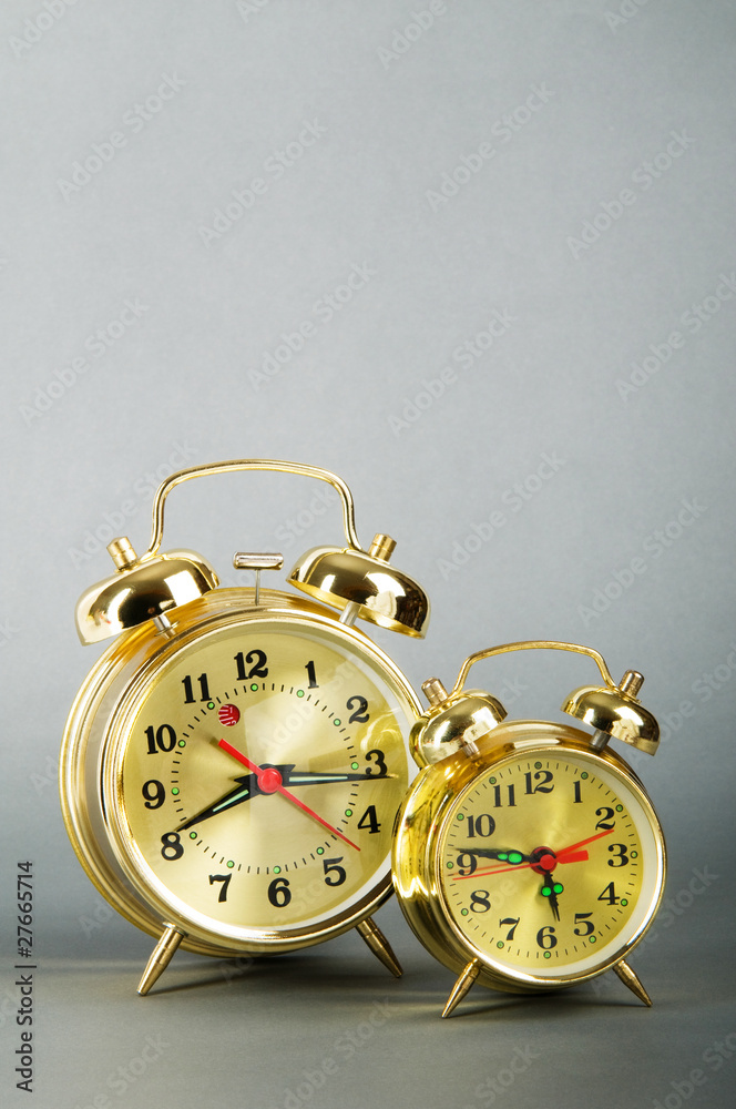 Time concept - alarm clock against colorful background Time concept - alarm clock against colorful background