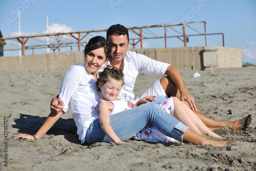 happy young  family have fun on beach © .shock