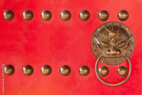 Decorated dragon on red door in Chinese temple,Thailand