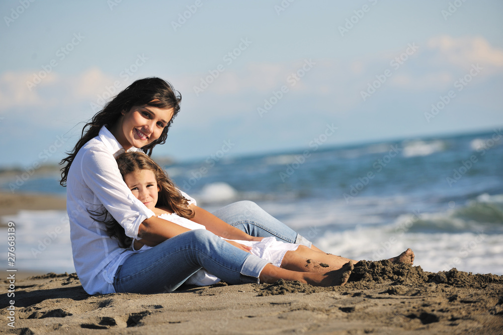 mom and daughter portrait on beach