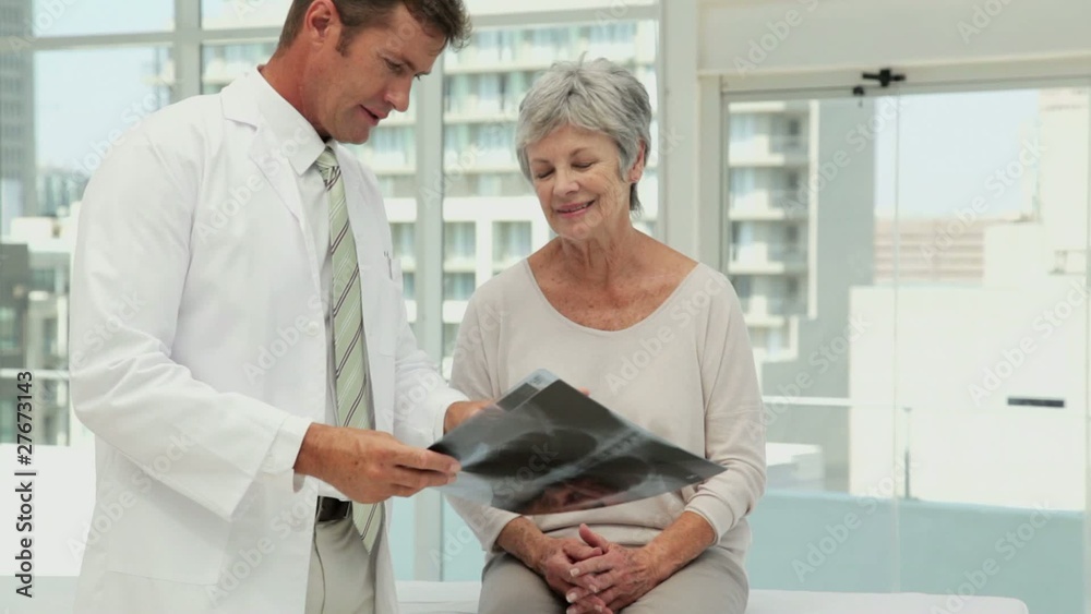 Doctor and Patient Looking Over X-Rays