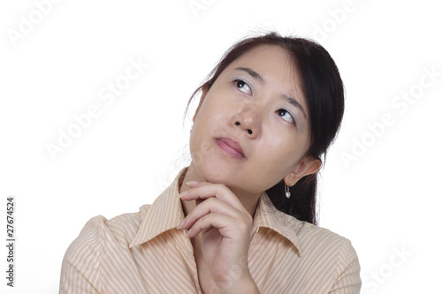 An Asian woman thinking isolated in white background © Adrin Shamsudin
