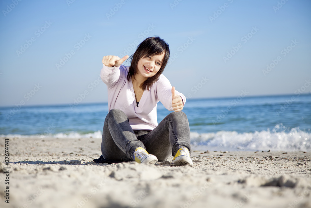 Portrait of brunette girl at the beach.