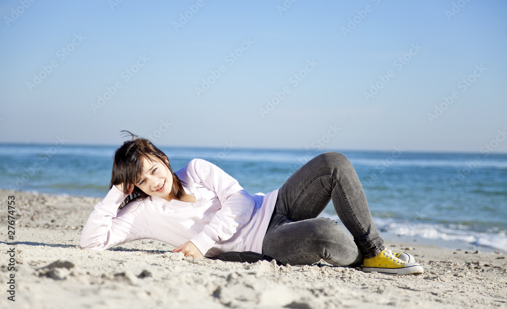 Portrait of brunette girl at the beach. Portrait of brunette girl at the beach.