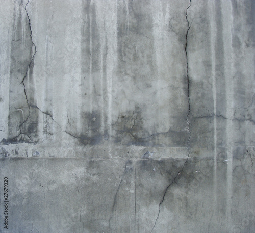 large section of a dirty grunge gray wall with white leaks and c