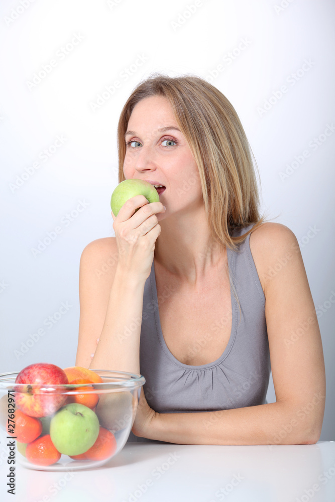 Closeup of beautiful woman holding green apple Closeup of beautiful woman holding green apple